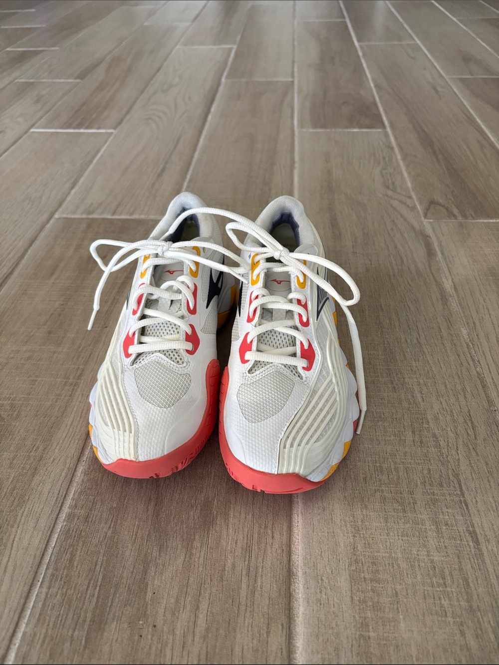 Mizuno woman’s White Athletic court Sneakers with Coral & Yellow Accents